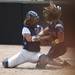 Saline junior catcher Layne Bond collides and tags out a Mattawan player in the game on Tuesday, June 11. Daniel Brenner I AnnArbor.com